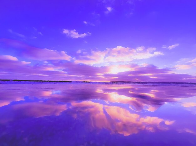 Scenic view of sea against romantic sky