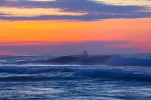 Photo scenic view of sea against sky during sunset