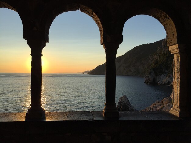 Photo scenic view of sea against sky during sunset