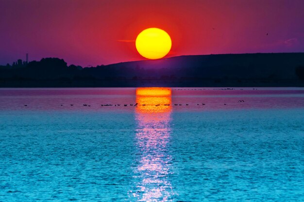 Scenic view of sea against sky during sunset