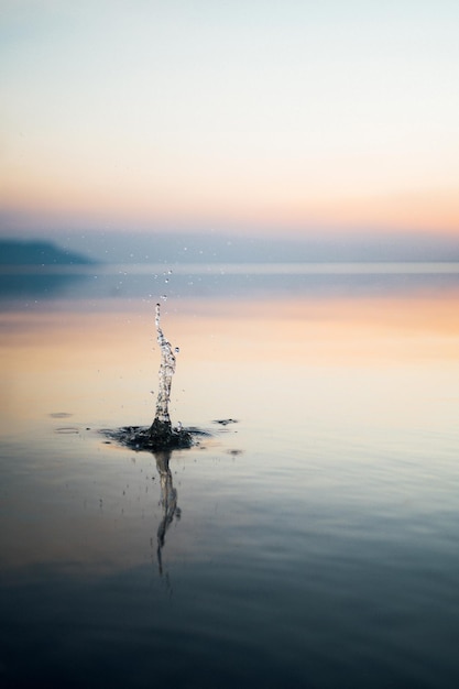 Photo scenic view of sea against sky during sunset