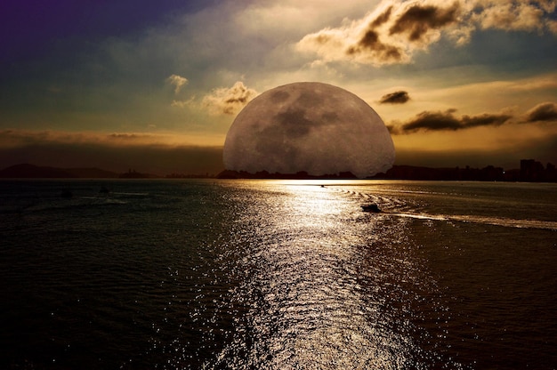 Photo scenic view of sea against sky during sunset