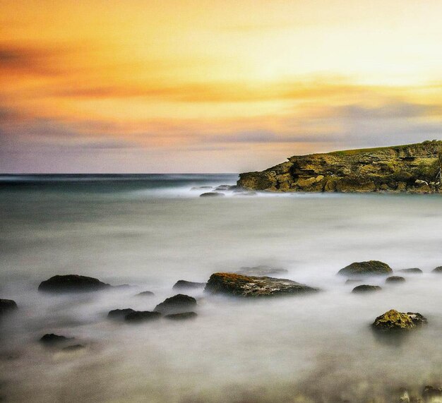 Scenic view of sea against sky during sunset