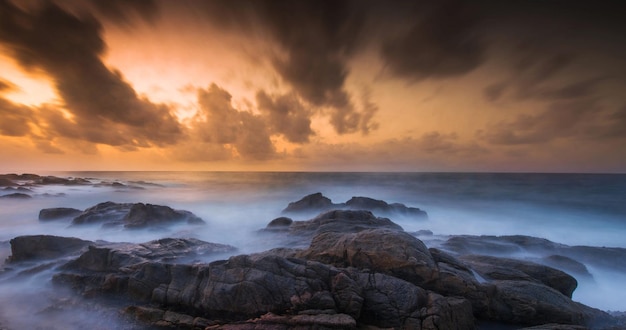 Photo scenic view of sea against sky during sunset