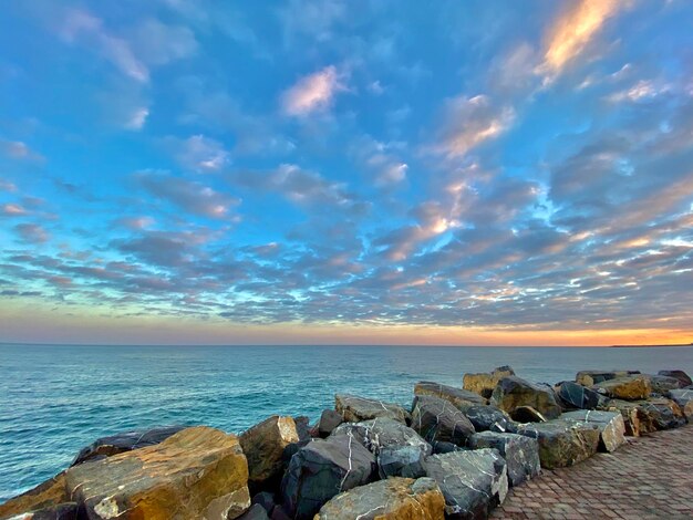 Scenic view of sea against sky during sunset