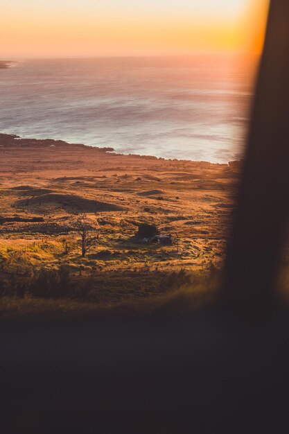 Photo scenic view of sea against sky during sunset