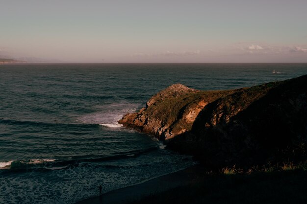 Photo scenic view of sea against sky during sunset