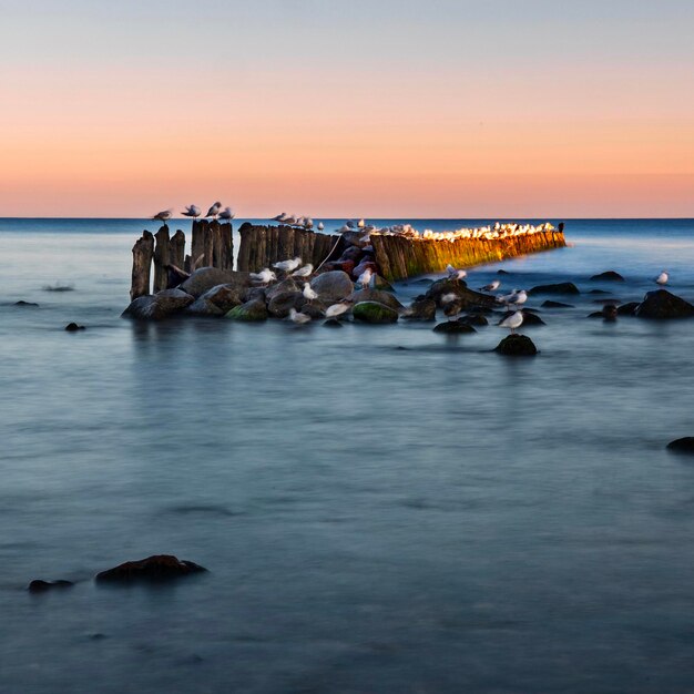 Scenic view of sea against sky during sunset