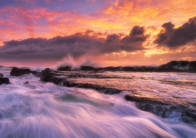 Photo scenic view of sea against sky during sunset