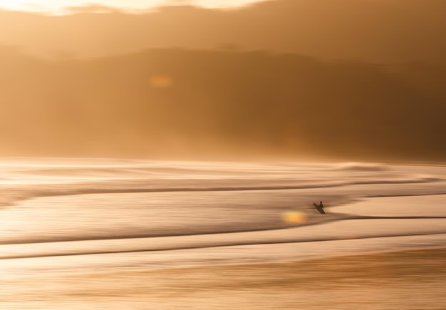 Photo scenic view of sea against sky during sunset