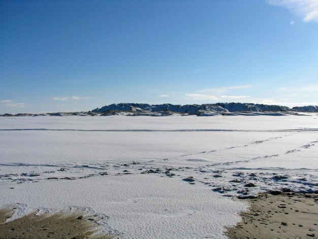 Scenic view of sea against sky during winter