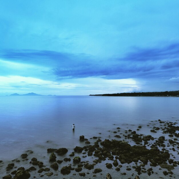 Scenic view of sea against sky at dusk