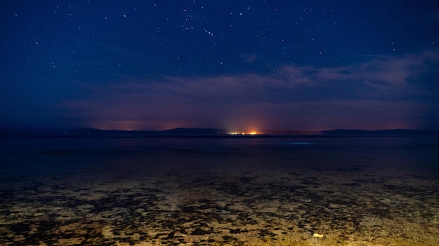 Scenic view of sea against sky at night