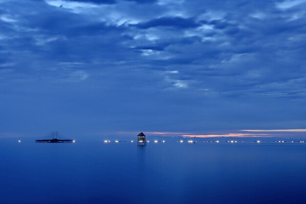 Scenic view of sea against sky at night