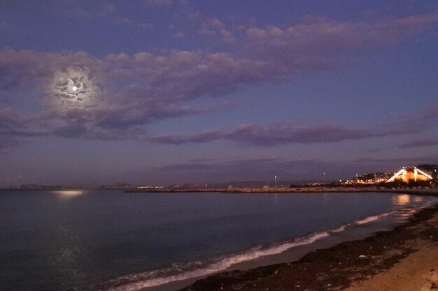 Scenic view of sea against sky at night