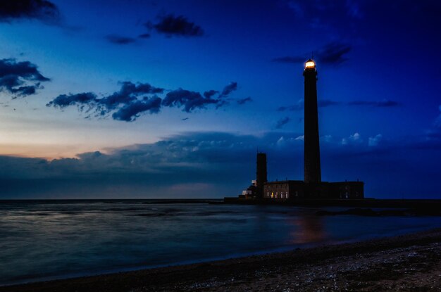 Scenic view of sea against sky at night