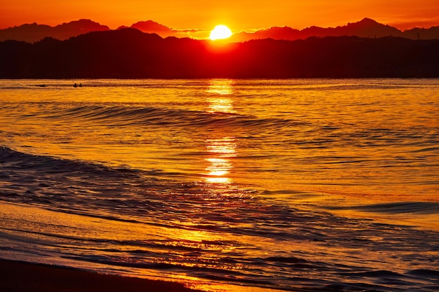 Scenic view of sea against sky during sunrise