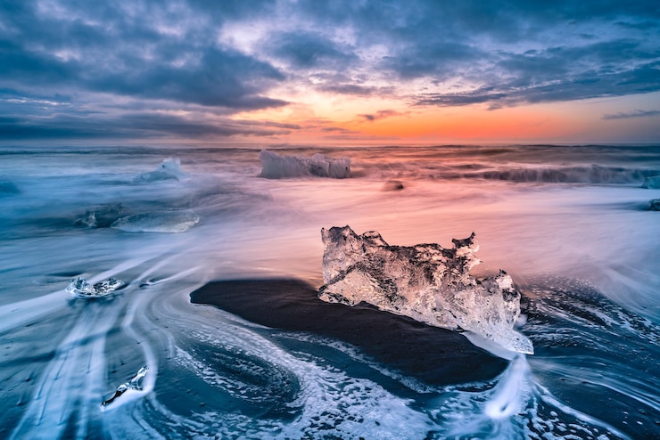 Photo scenic view of sea against sky at sunset