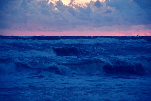 Scenic view of sea against sky at sunset