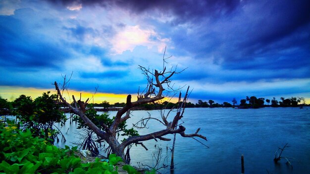 Scenic view of sea against sky at sunset