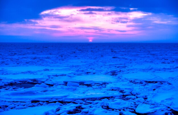 Scenic view of sea against sky at sunset