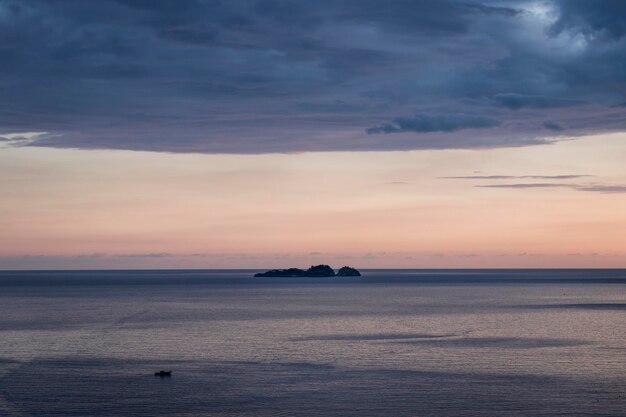 Scenic view of sea against sky at sunset