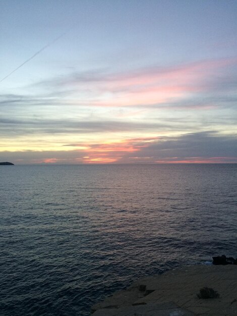 Scenic view of sea against sky at sunset