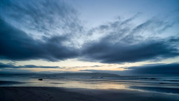 Scenic view of sea against sky at sunset