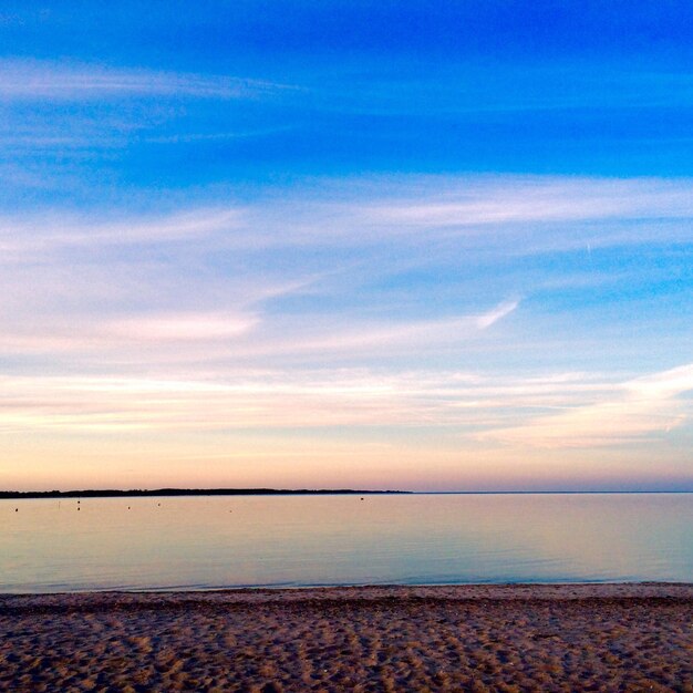 Scenic view of sea against sky at sunset