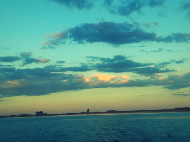 Scenic view of sea against sky at sunset