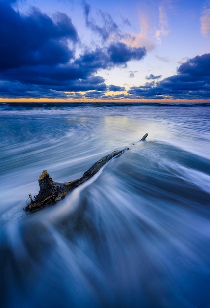 Scenic view of sea against sky at sunset