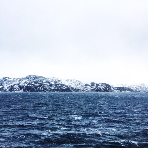 Scenic view of sea against sky during winter