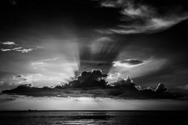 Scenic view of sea against storm clouds