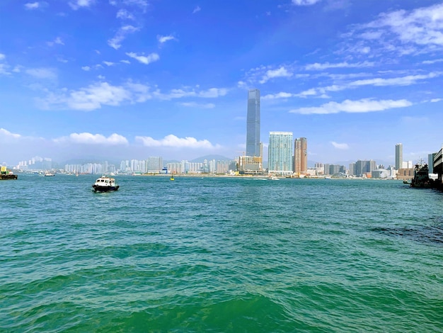 Scenic view of sea and buildings against sky