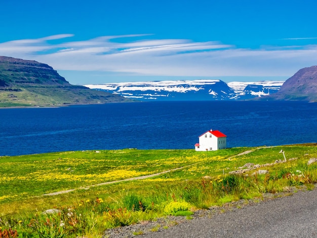 Scenic view of sea by buildings against sky