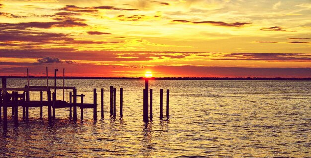 Photo scenic view of sea during sunset