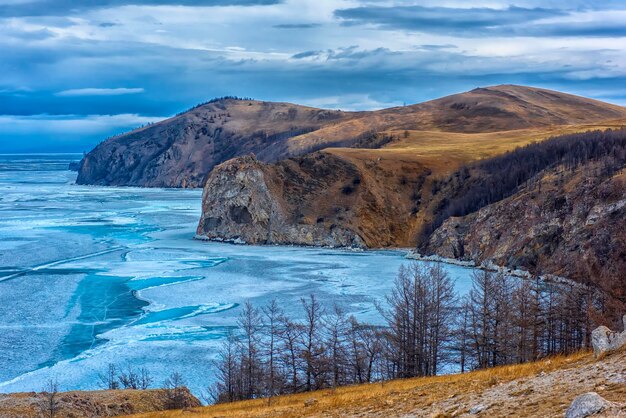 Scenic view of sea and mountains against sky