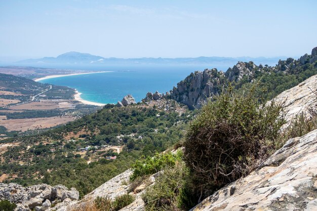 Scenic view of sea and mountains against sky