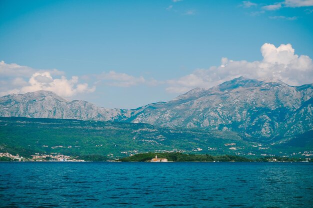 Scenic view of sea and mountains against sky