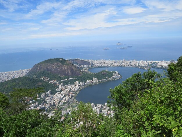 Scenic view of sea and mountains against sky