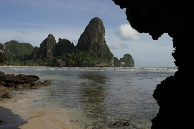 Scenic view of sea and mountains against sky