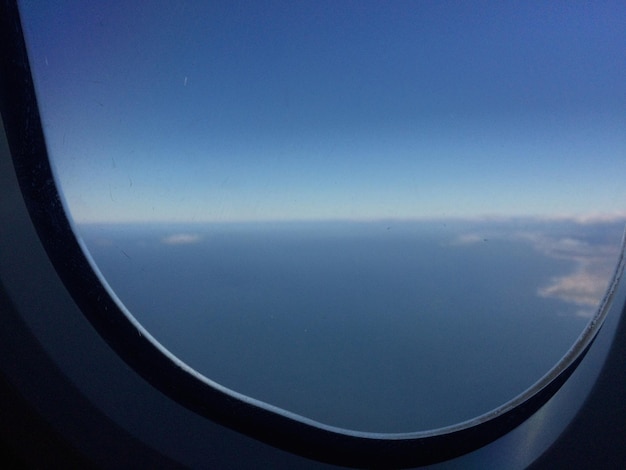 Scenic view of sea seen through airplane window