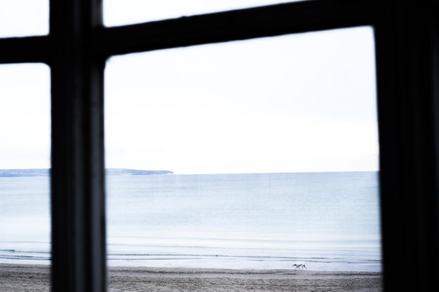 Scenic view of sea seen through window