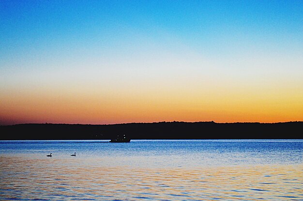 Scenic view of sea at sunset