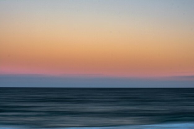 Photo scenic view of sea at sunset