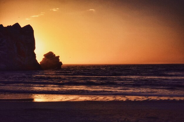 Photo scenic view of sea at sunset