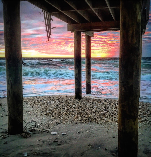 Photo scenic view of sea at sunset