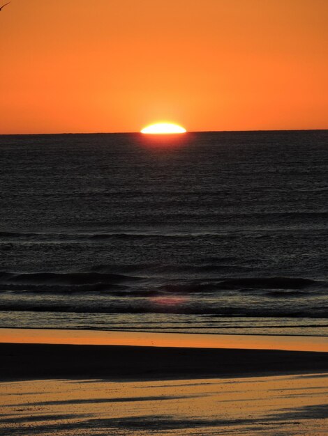 Scenic view of sea at sunset