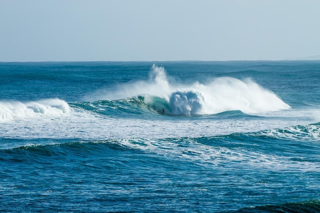 Scenic view of sea waves against sky