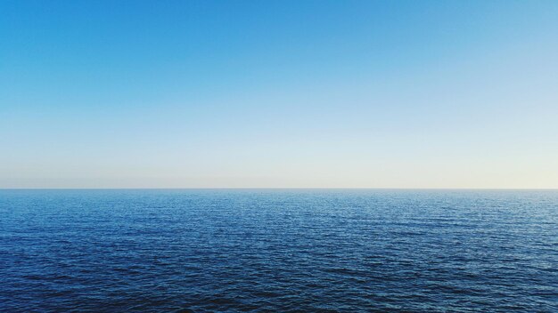 Scenic view of seascape against clear sky